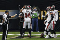 Tampa Bay Buccaneers quarterback Tom Brady hugs wide receiver Chris Godwin (14) after Brady's rushing touchdown in the first half of an NFL football game against the New Orleans Saints in New Orleans, Sunday, Sept. 13, 2020. (AP Photo/Butch Dill)
