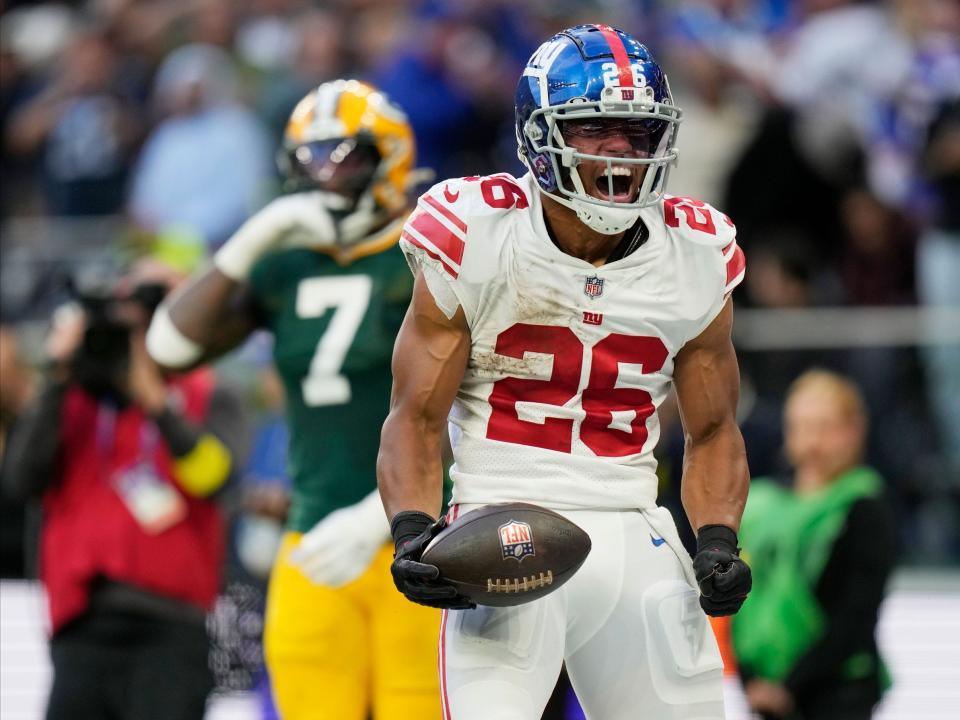 Saquon Barkley celebrates after scoring a touchdown against the Green Bay Packers.