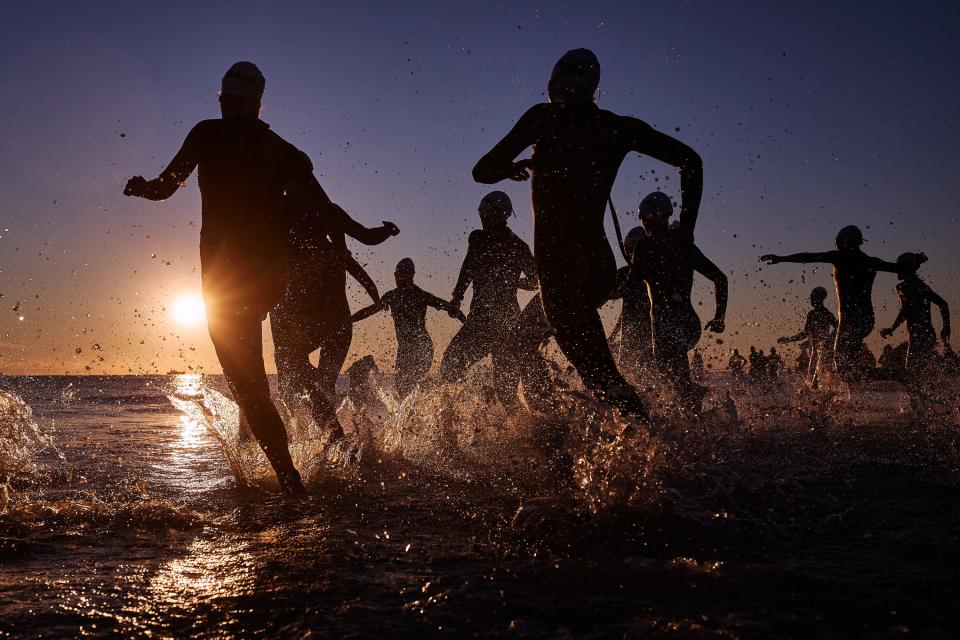 Athletes compete in the swim section during the IRONMAN Emilia Romagna on Sept. 18, 2022.