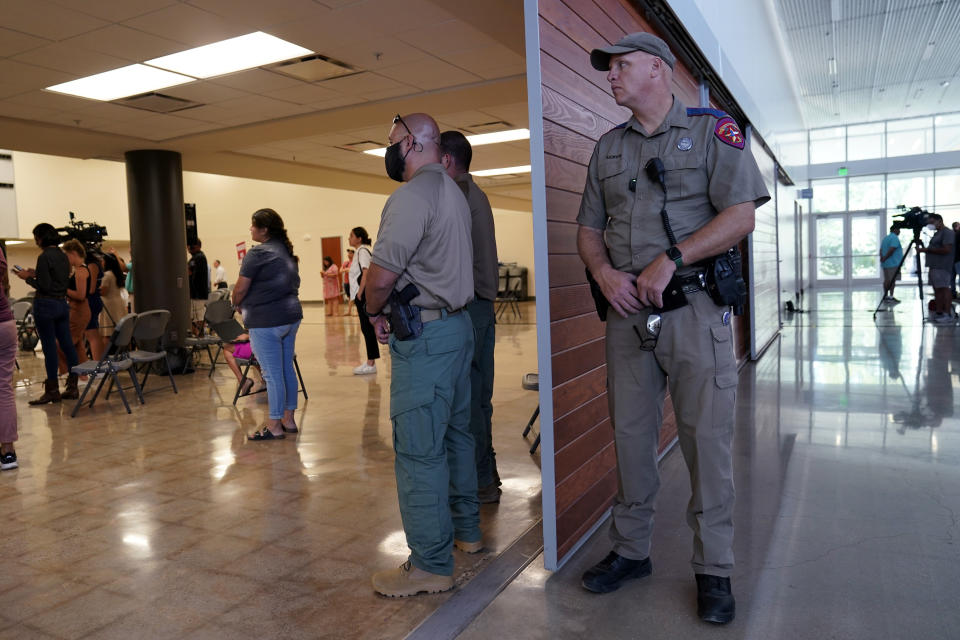 A Texas State Trooper and other members of law enforcement listen to the Texas House investigative committee during a news conference after they released a full report on the shootings at Robb Elementary School, Sunday, July 17, 2022, in Uvalde, Texas. (AP Photo/Eric Gay)