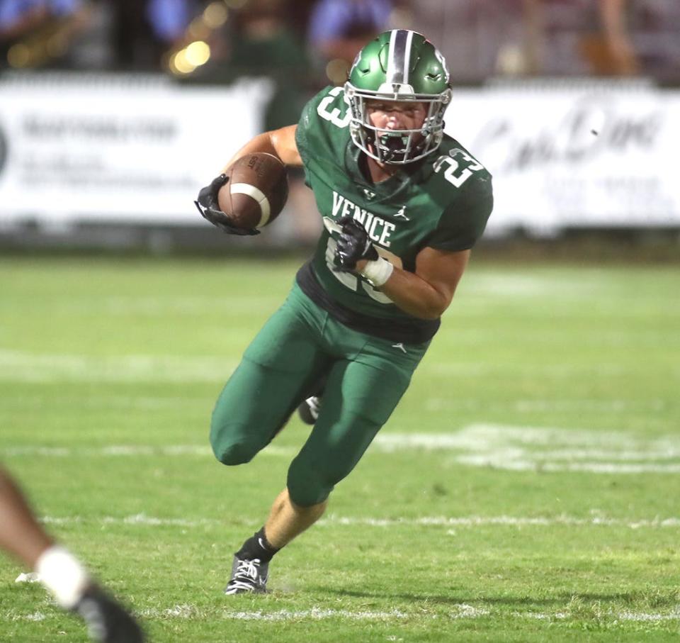 Venice High running back Griffin Gisotti (23) heads up field against Tampa Bay Tech during the FHSAA Kickoff Classic game at Venice High School.