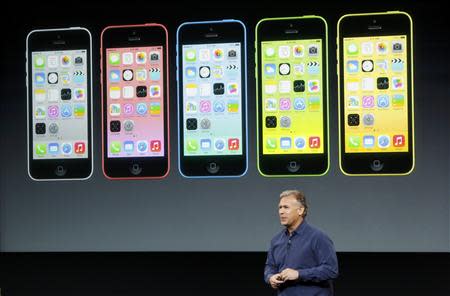 Phil Schiller, senior vice president of worldwide marketing for Apple Inc, talks about the new iPhone 5C at Apple Inc's media event in Cupertino, California September 10, 2013. REUTERS/Stephen Lam