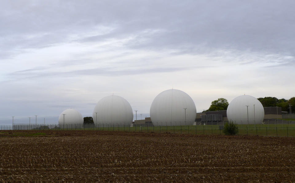 Satellite dishes inside Kevlar domes line a field at the Kester Satellite Ground Station in Kester, Belgium, Thursday, Oct. 15, 2020. This week, the site at Kester, which has been in use for decades but was totally overhauled in 2014, is set to fall under a new orbit, when NATO announces that it is creating a space center to help manage satellite communications and key parts of its military operations around the world. (AP Photo/Lorne Cook)