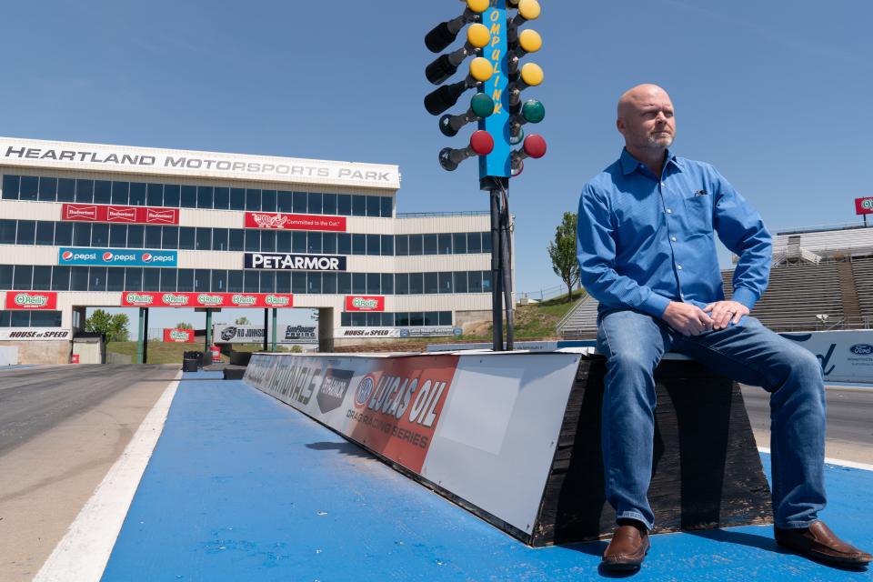 Heartland Motorsports Park owner Chris Payne sits by the starting lights of the drag strip last year after surveying some of the facility's issues.