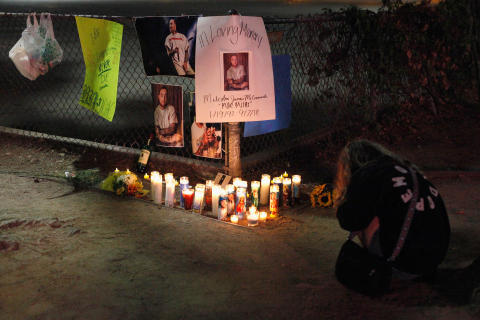 Fans gather at makeshift memorial for late rapper Mac Miller at the corner of Fairfax and Melrose Avenues on Sept. 8, 2018 in Los Angeles. - Credit: Katharine Lotze/Getty Images