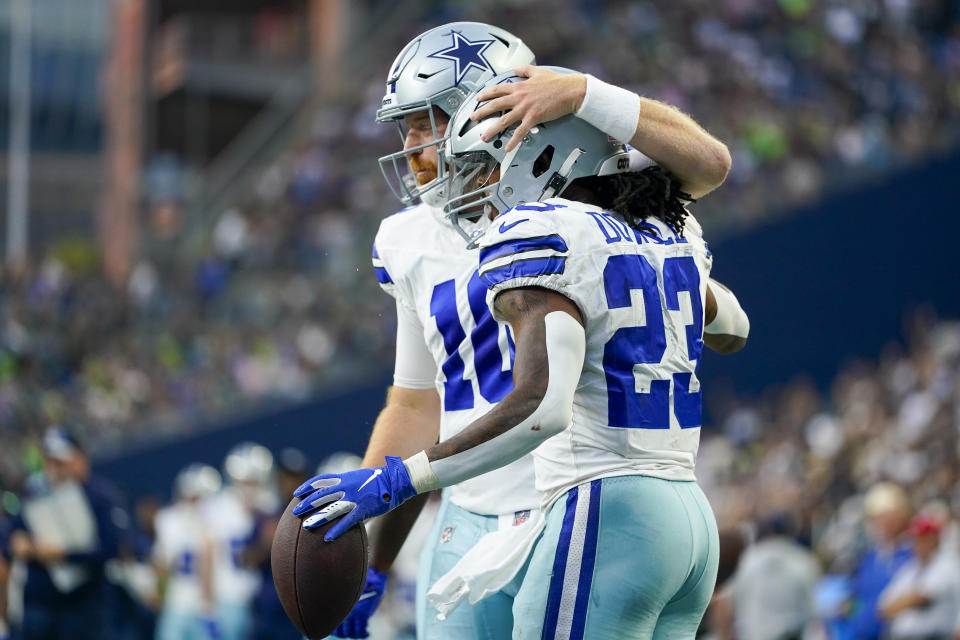 Dallas Cowboys running back Rico Dowdle celebrates after scoring with quarterback Cooper Rush during the first half of a preseason NFL football game against the Seattle Seahawks Saturday, Aug. 19, 2023, in Seattle. (AP Photo/Lindsey Wasson)