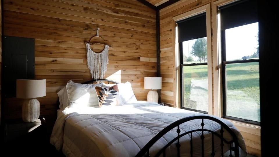A bedroom in Cabin Three on Tuesday, July 25, 2023 at Bourbon Barrel Cottages in Lawrenceburg, Ky.
