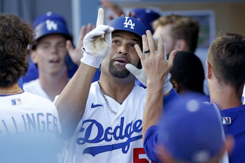 LOS ANGELES, CA - MAY 29: Los Angeles Dodgers first baseman Albert Pujols (55) celebrates with teammates.