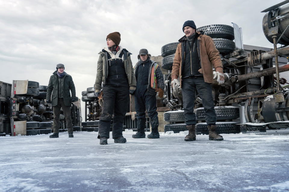 This image released by Netflix shows Benjamin Walker, Amber Midthunder, Marcus Thomas and Liam Neeson in a scene from "The Ice Road." (Allen Fraser/Netflix via AP)