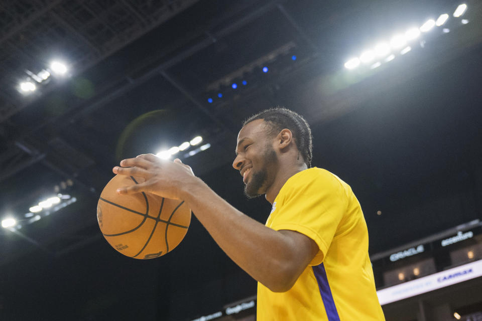 Los Angeles Lakers guard Bronny James dribbles before an NBA summer league basketball game against the Golden State Warriors in San Francisco, Sunday, July 7, 2024. (AP Photo/Nic Coury)