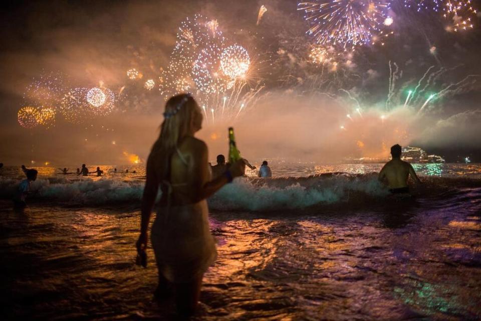 Fireworks light the sky over Copacabana beach during New Year’s Eve celebrations in Rio de Janeiro, Brazil, Thursday, Jan. 1, 2016. (AP Photo/Mauro Pimentel)