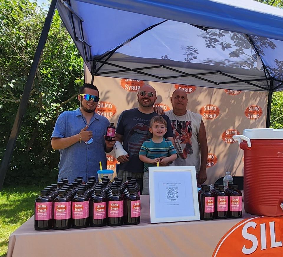 Silmo Syrup team members were at the Whaling City Festival to debut Silmo's new strawberry flavor before it hits store shelves. Left to right: Nick Silvia, New Bedford City Councilor and Silmo Syrup owner Ian Abreu; his father, Steve Abreu and son Hunter Abreu.