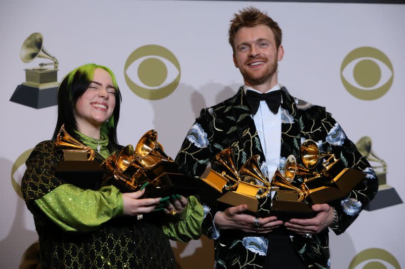 FILE PHOTO: 62nd Grammy Awards – Photo Room – Los Angeles, California, U.S., January 26, 2020 - Billie Eilish and Finneas O'Connell pose backstage with her awards