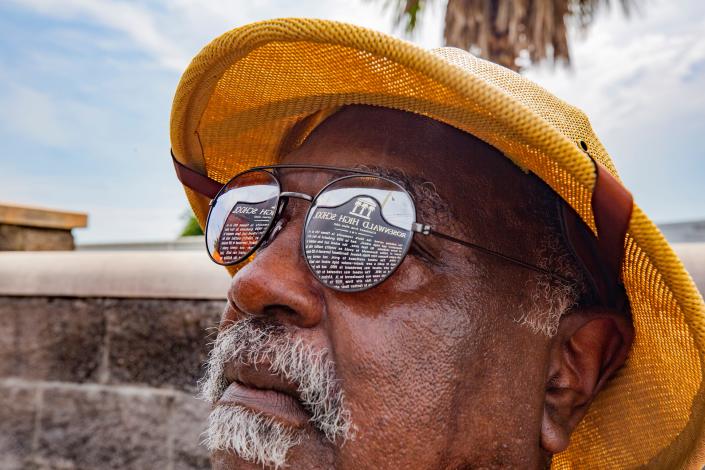 Henry C. Godwin Jr. looks up at a historical marker that reflects in his glasses during a ceremony to dedicate the marker for Rosenwald High School on June 16, 2021 in Panama City. The marker recognizes Rosenwald H.S. and the classes that attended from 1937 to 1967. In 1968 students were split up to desegregate the city schools. Godwin was a member of the class of 1968 and organized the effort to get the marker for the school.