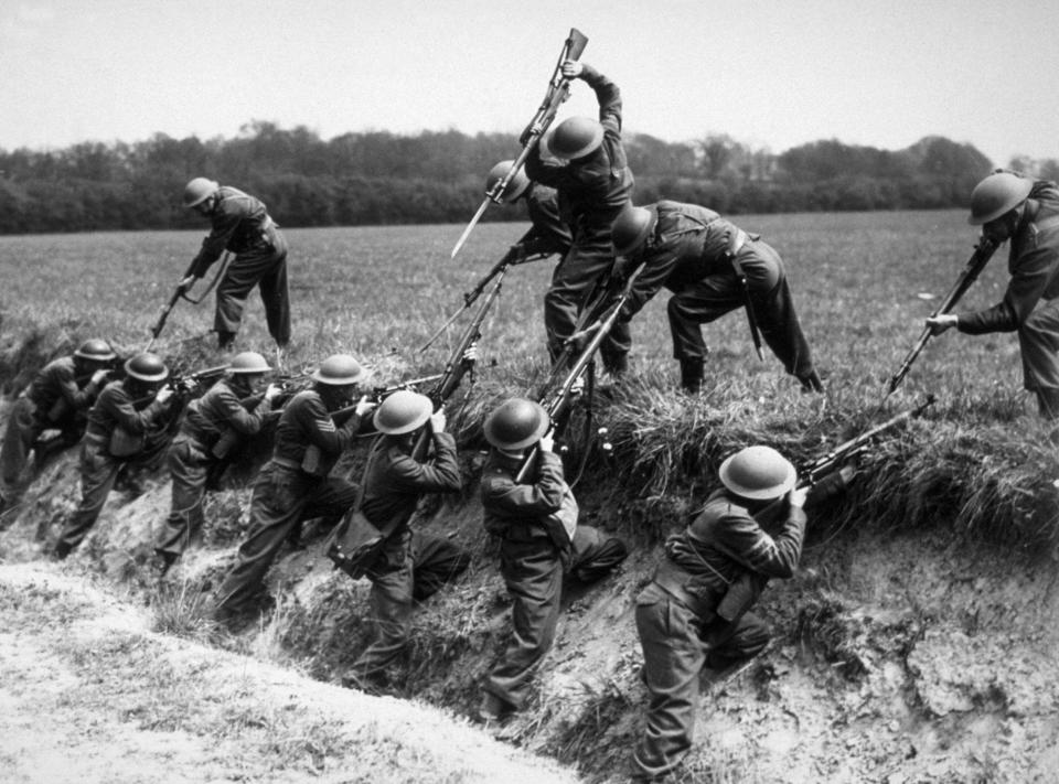 Members of the Home Guard practicing combat techniques during maneuvers around 1939.