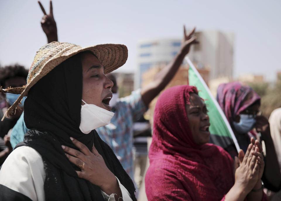 People chant slogans during a protest in Khartoum, Sudan, Saturday, Oct. 30, 2021. Pro-democracy groups called for mass protest marches across the country Saturday to press demands for re-instating a deposed transitional government and releasing senior political figures from detention. (AP Photo/Marwan Ali)