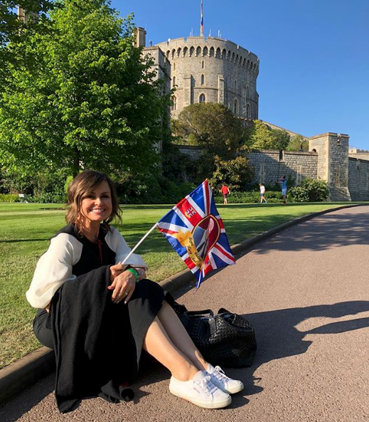 <p>Lisa posed in front of Windsor Castle in Windsor London where Prince Harry and Meghan Markle tied the knot.<br>The Channel Ten star went for a more understated look here.<br>Source: Instagram/lisa_wilkinson </p>