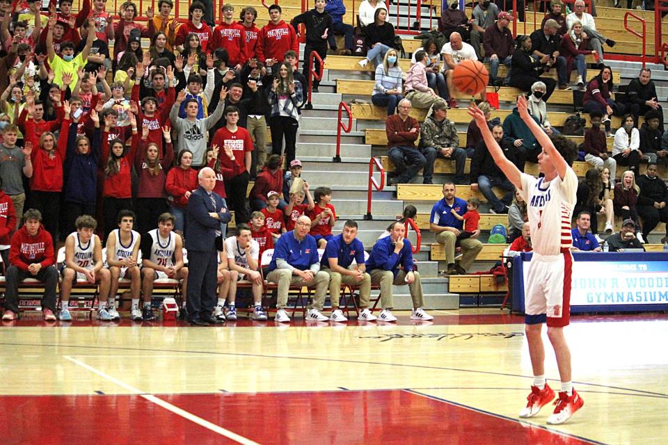 Martinsville senior Landon Myers shoots a technical foul shot in front of a big student section and his team's bench during Friday's game at home against Bloomington North. 