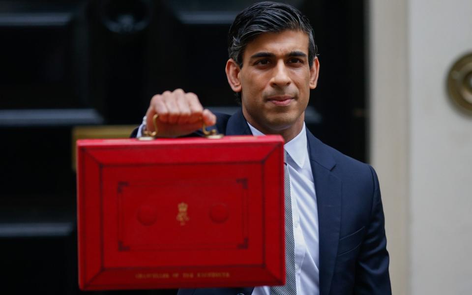 Rishi Sunak with his March Budget - Hollie Adams/Bloomberg