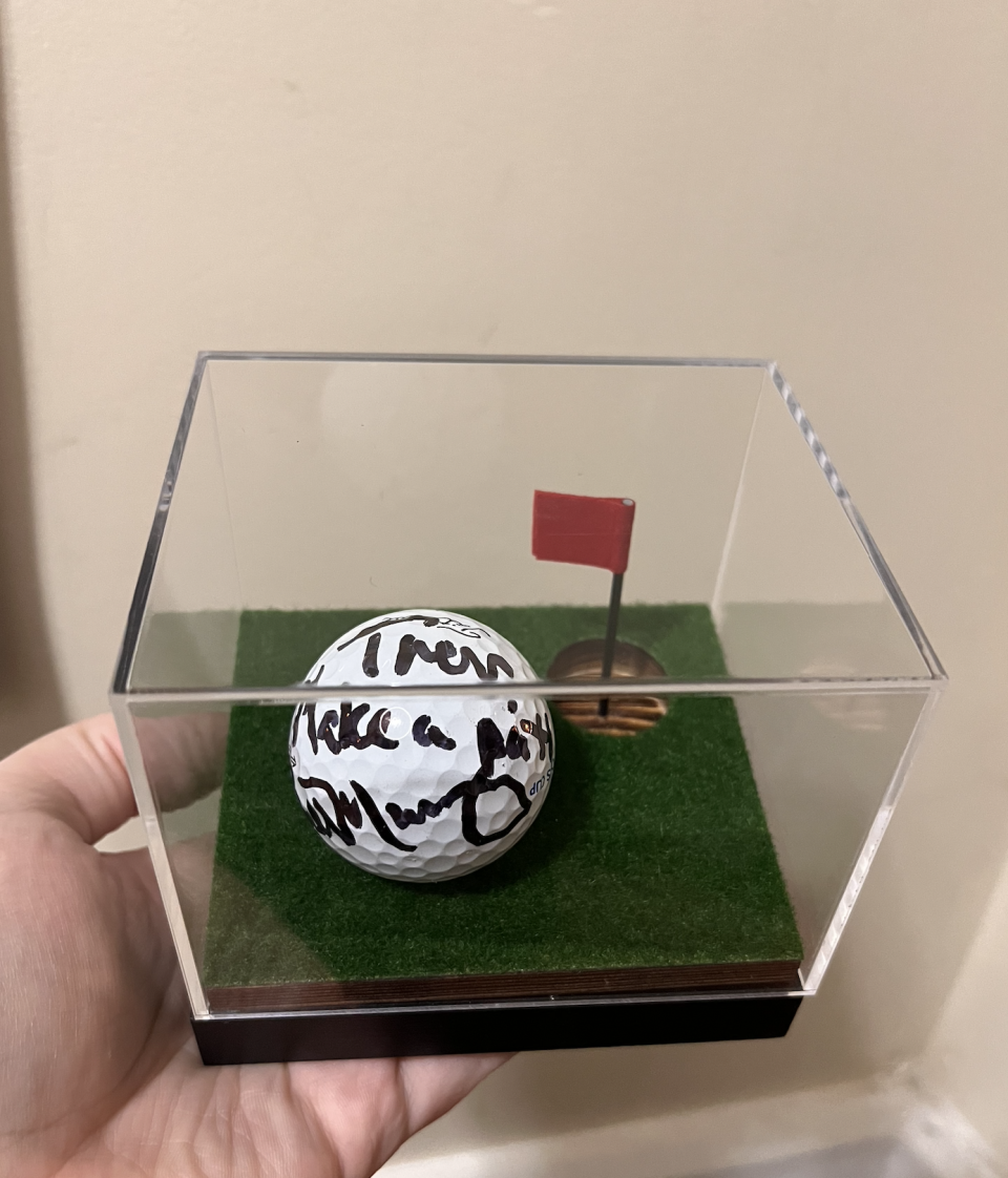 Kimberly McCarthy shows the golf ball that Bill Murray signed for her husband, Trevor.
