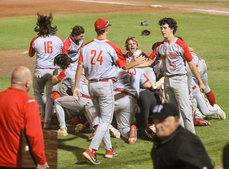 Centennial celebrates their Central Section D-1 baseball championship victory over Buchanan at Valley Strong Ballpark on Saturday, May 28, 2023.