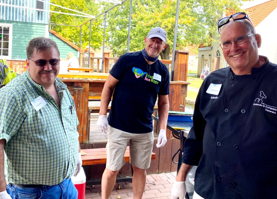 Orlando Grossi, right, with his catering team.