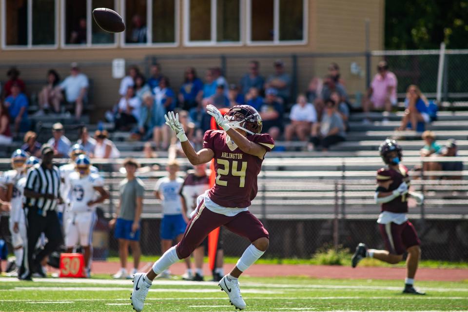 Arlington's Robbie Jordan catches the ball to score a touchdown during the week 0 high school football game at Arlington High School in Freedom Plains, NY on Saturday, September 2, 2023. Arlington defeated Kellenberg 49-21.
