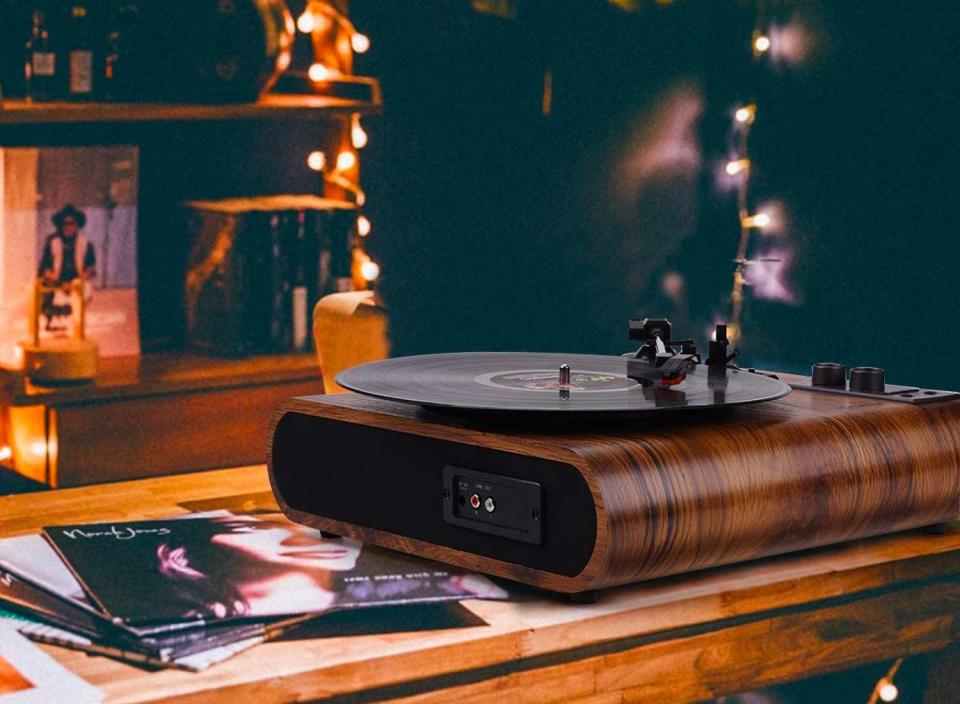 This cool vintage-inspired turntable would make a great gift for any vinyl-loving dad out there. (Source: Amazon)