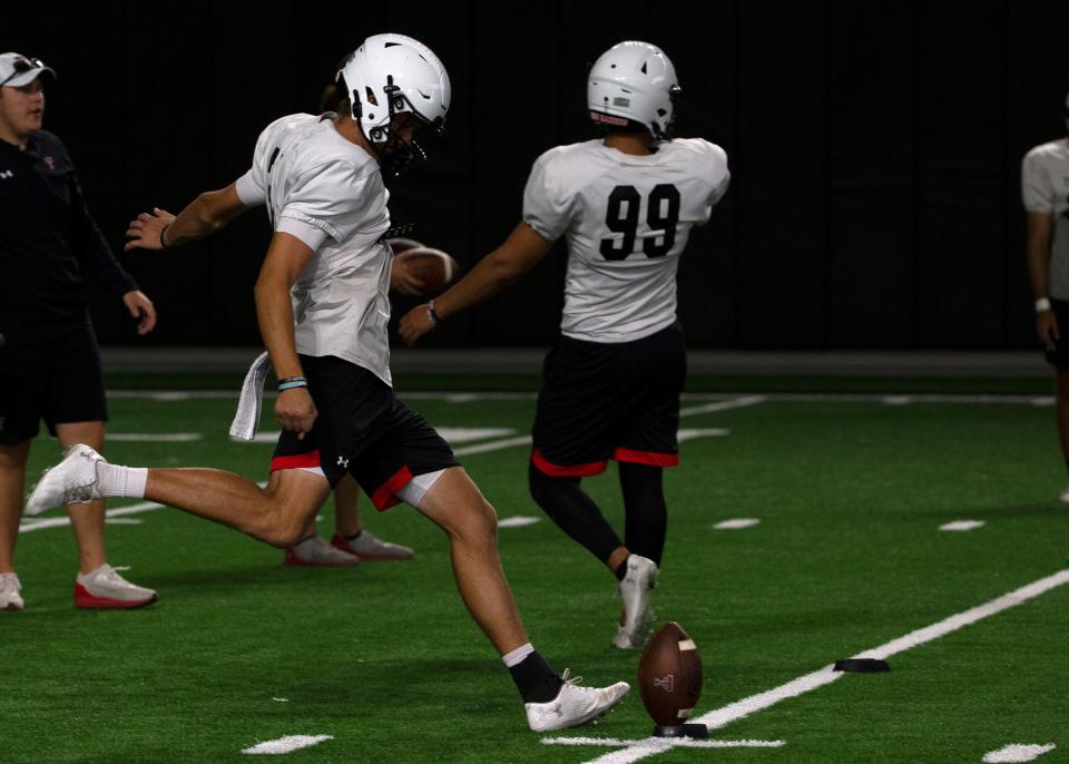 Texas Tech's Austin McNamara works on kicking off during a practice last year. McNamara has four of the top eight single-season punting averages in Tech history, and he and Tech coach Joey McGuire want him to kick off this year to broaden his appeal as an NFL prospect.