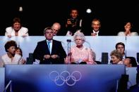 <p>Queen Elizabeth makes remarks at the 2012 London opening ceremony. This was moments after organizers created a fun introduction featuring the 007 character James Bond (<strong>Daniel Craig</strong>) and made it seem as though Her Majesty <a href="https://www.youtube.com/watch?v=1AS-dCdYZbo" rel="nofollow noopener" target="_blank" data-ylk="slk:arrived by sky-diving;elm:context_link;itc:0;sec:content-canvas" class="link ">arrived by sky-diving</a> into the stadium. </p>