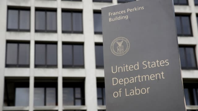 A sign stands outside the U.S. Department of Labor's headquarters