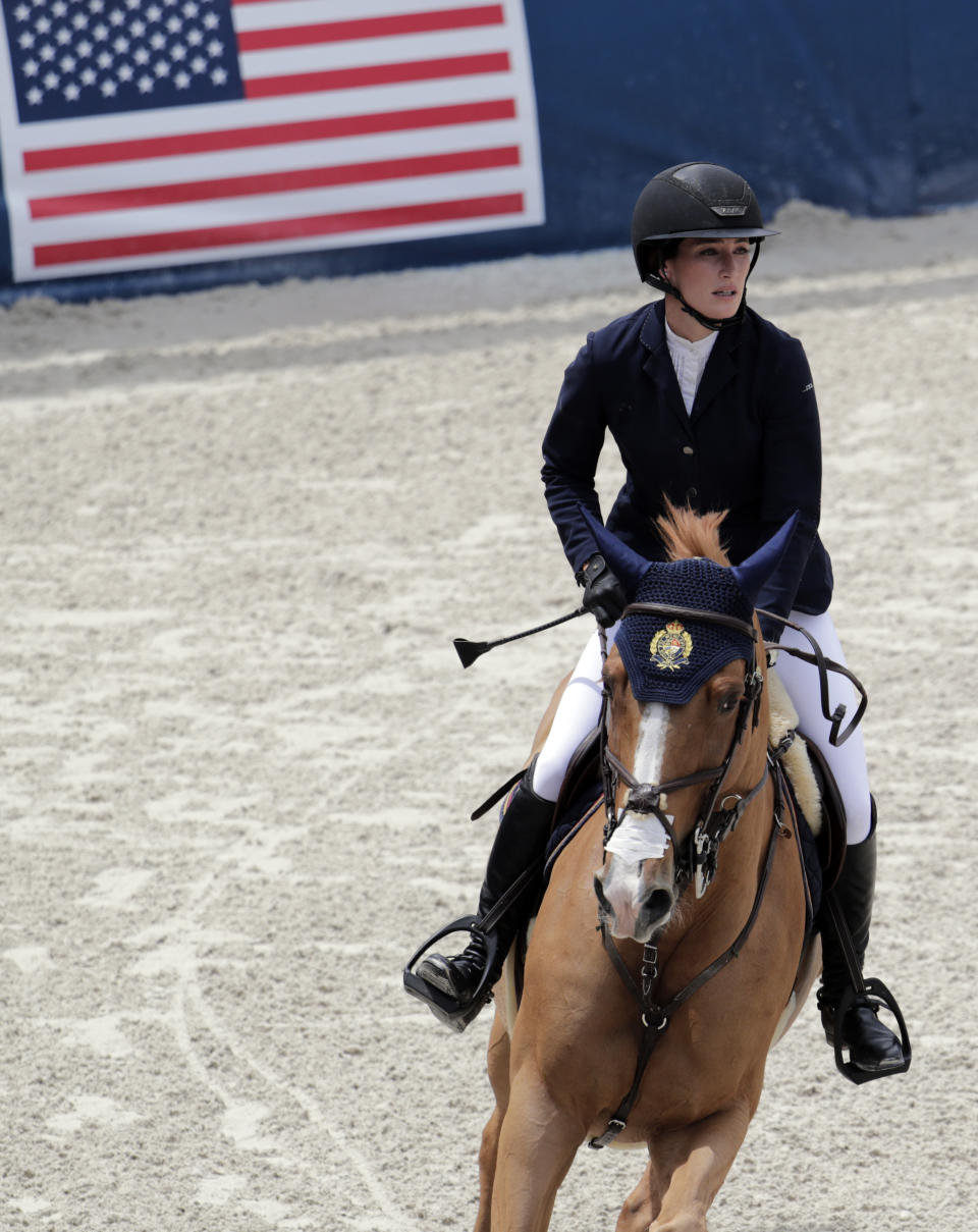FILE - Jessica Springsteen competes during the Global Champions Tour equestrian event in Miami Beach, Fla., in this April 20, 2019, file photo. The daughter of rock icon Bruce Springsteen and singer-songwriter Patti Scialfa has been selected as one of four riders on the U.S. jumping team that will compete at the Tokyo Olympics. Twenty-nine-year-old Jessica Springsteen is making her Olympic debut.(AP Photo/Lynne Sladky, File)