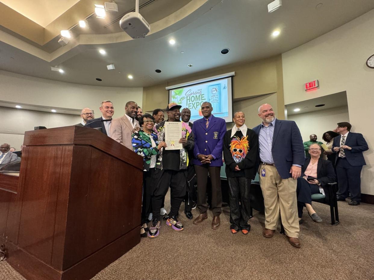 George Clinton, of Parliament-Funkadelic, stands with the Leon County Commission and his brothers of Omega Psi Phi Fraternity Inc. as he receives a special proclamation from the commission honoring his career and his time in Leon County.