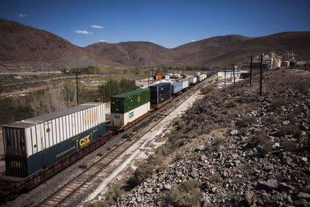 A train rumbles through the Tahoe Reno Industrial Center in McCarran, Nevada, September 16, 2014. REUTERS/Max Whittaker