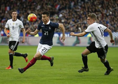 Football Soccer - France v Germany - International Friendly match - Stade de France, 13/11/15. France's Laurent Koscielny in action with Germany's Matthias Ginter. REUTERS/Benoit Tessier