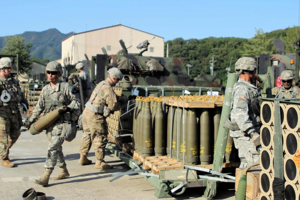 U.S. Army soldiers carry 155mm shells during a military exercise in South Korea in 2016.