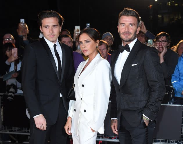 Brooklyn with his parents Victoria and David Beckham in 2019