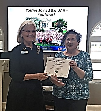 The Ponce de Leon National Chapter of the Daughters of the American Revolution Chapter Regent Chris Page presented Andi Brannon with a certificate from the Florida State Society DAR at the October meeting in recognition of her work on the State Constitution Committee.