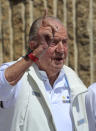 Spain's former King Juan Carlos gestures before a reception at a nautical club prior to a yachting event in Sanxenxo, north western Spain, Friday, May 20, 2022. Spain's former King has returned to Spain for his first visit since leaving nearly two years ago amid a cloud of financial scandals. (AP Photo/Lalo R. Villar)