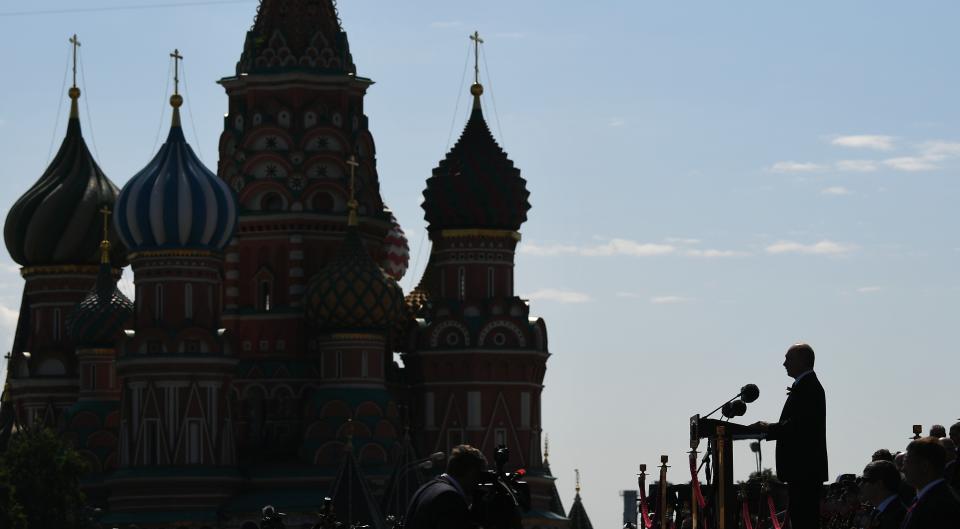 Russian President Vladimir Putin is seen from the side as he speaks during a Victory Day military parade. 