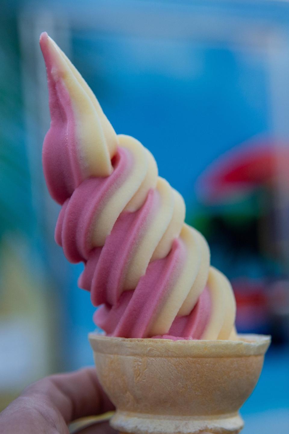 A strawberry and pineapple Dole Whip served in a cone can be bought at Pineapple Dream for $3.