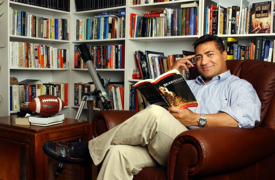 Former mayoral candidate Molonai Hola poses in his reading room at his Salt Lake City home on Sept. 15, 2003. | Michael Brandy, Deseret News