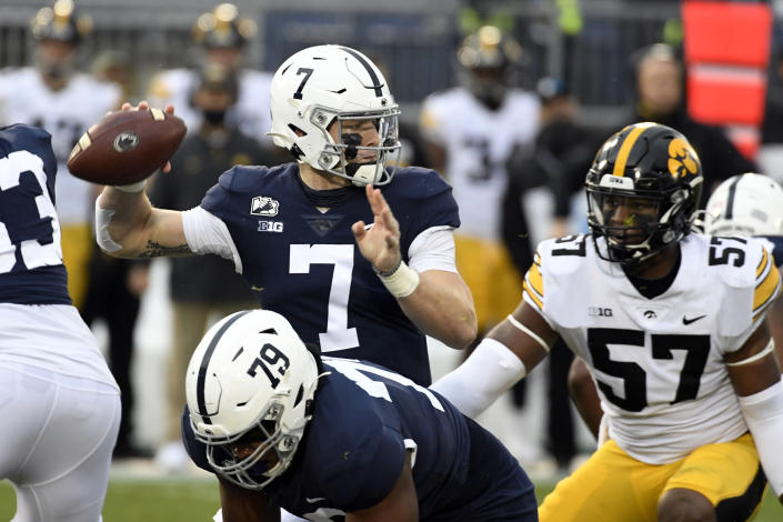 Penn State quarterback Will Levis (7) looks to pass as Iowa defensive lineman Chauncey Golston (57) closes in during the first quarter of an NCAA college football game in State College, Pa., on Saturday, Nov. 21, 2020. (AP Photo/Barry Reeger)