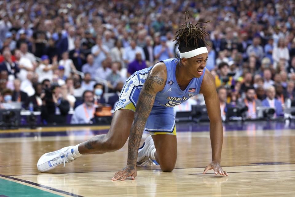 NEW ORLEANS, LOUISIANA - APRIL 04: Armando Bacot #5 of the North Carolina Tar Heels rects in pain in the second half of the game against the Kansas Jayhawks during the 2022 NCAA Men's Basketball Tournament National Championship at Caesars Superdome on April 04, 2022 in New Orleans, Louisiana. (Photo by Tom Pennington/Getty Images)