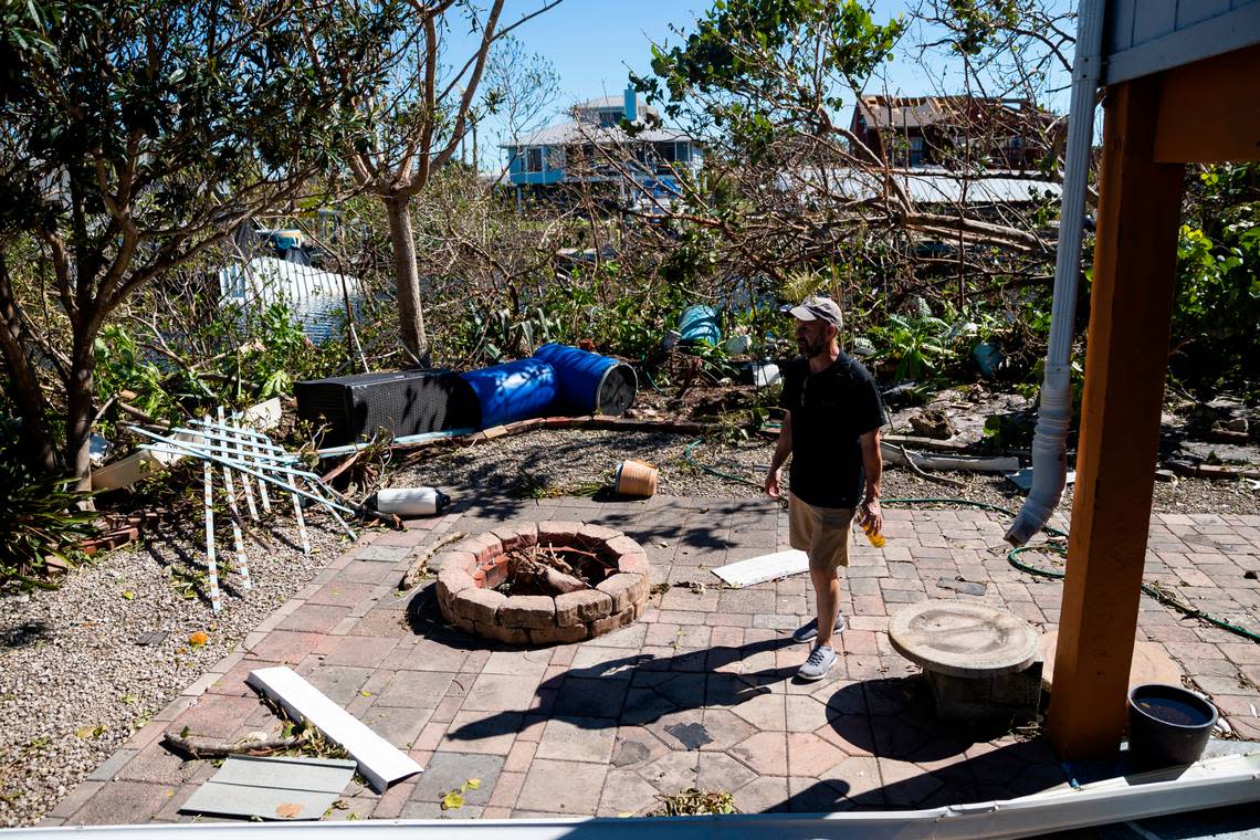 Mike Romeo, 53, surveys damage at his St. James City home on Friday, Sept. 30, 2022, in Pine Island, Fla. Romeo has lived on Pine Island for years. Hurricane Ian made landfall on the coast of South West Florida as a category 4 storm Tuesday afternoon leaving areas affected with flooded streets, downed trees and scattered debris.