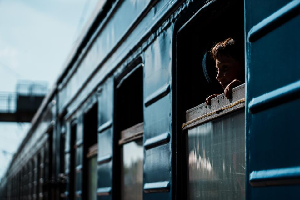 Child leaves on evacuation train in Ukraine.