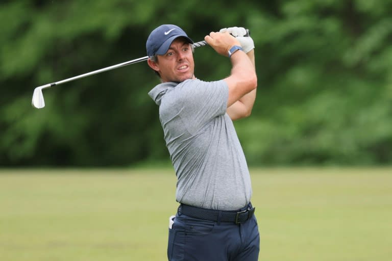 Four-time major winner Rory McIlroy of Northern Ireland fired a two-under par 70 to grab a share of the lead after the third round of the PGA Memorial tournament