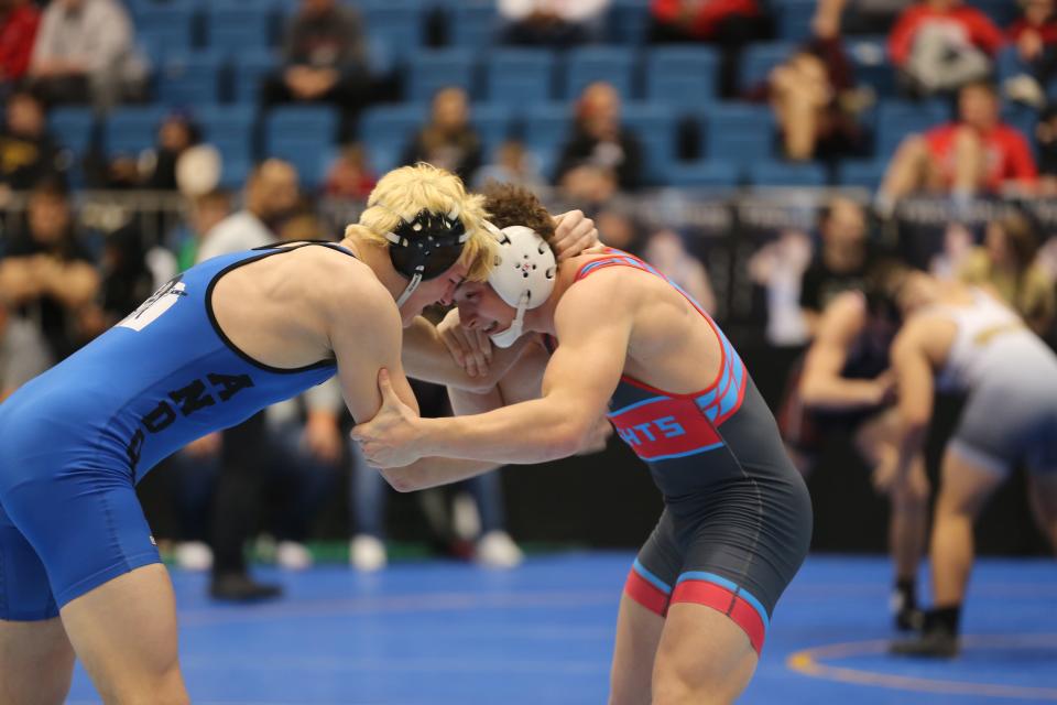 Shawnee Heights' Allen Baughman followed up an incredible year on the gridiron with a sixth-place finish at state wrestling.