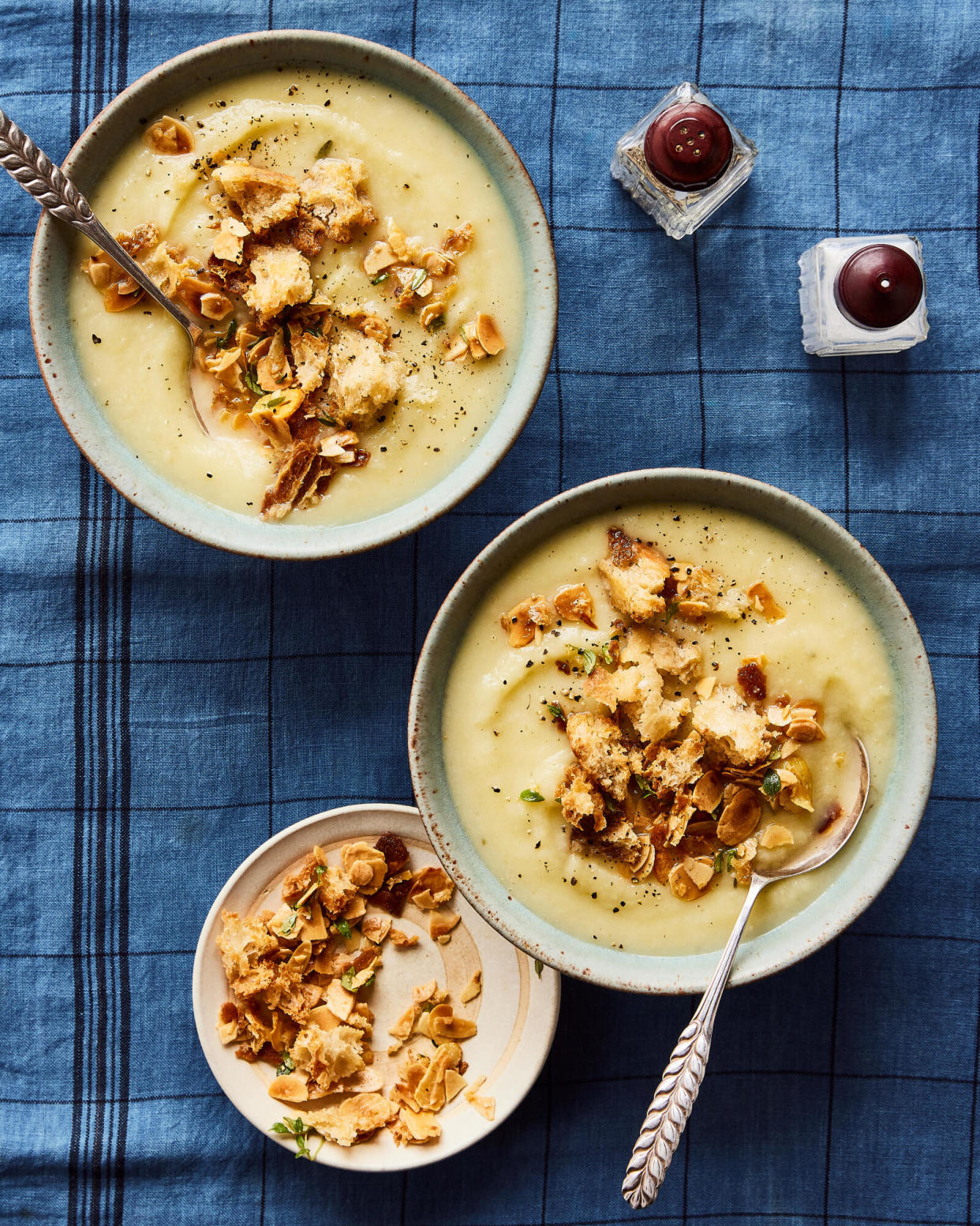 <span>Georgina Hayden’s celeriac soup with almond pangrattato.</span><span>Photograph: Emma Guscott/The Guardian. Food styling: Ellie Mulligan. Prop styling: Anna Wilkins. Food styling assistant: Alice Earll.</span>