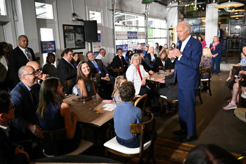 Biden shrugs off calls to exit presidential race as he takes aim at